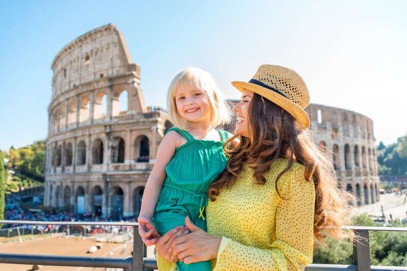 Mother and child in front of the Colosseum, Rome, Italy